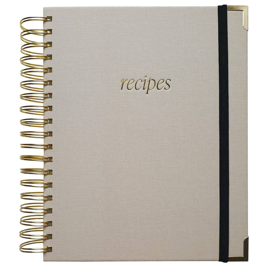 Cookbook with 'recipes' on the cover, gold spiral binding, and black band.