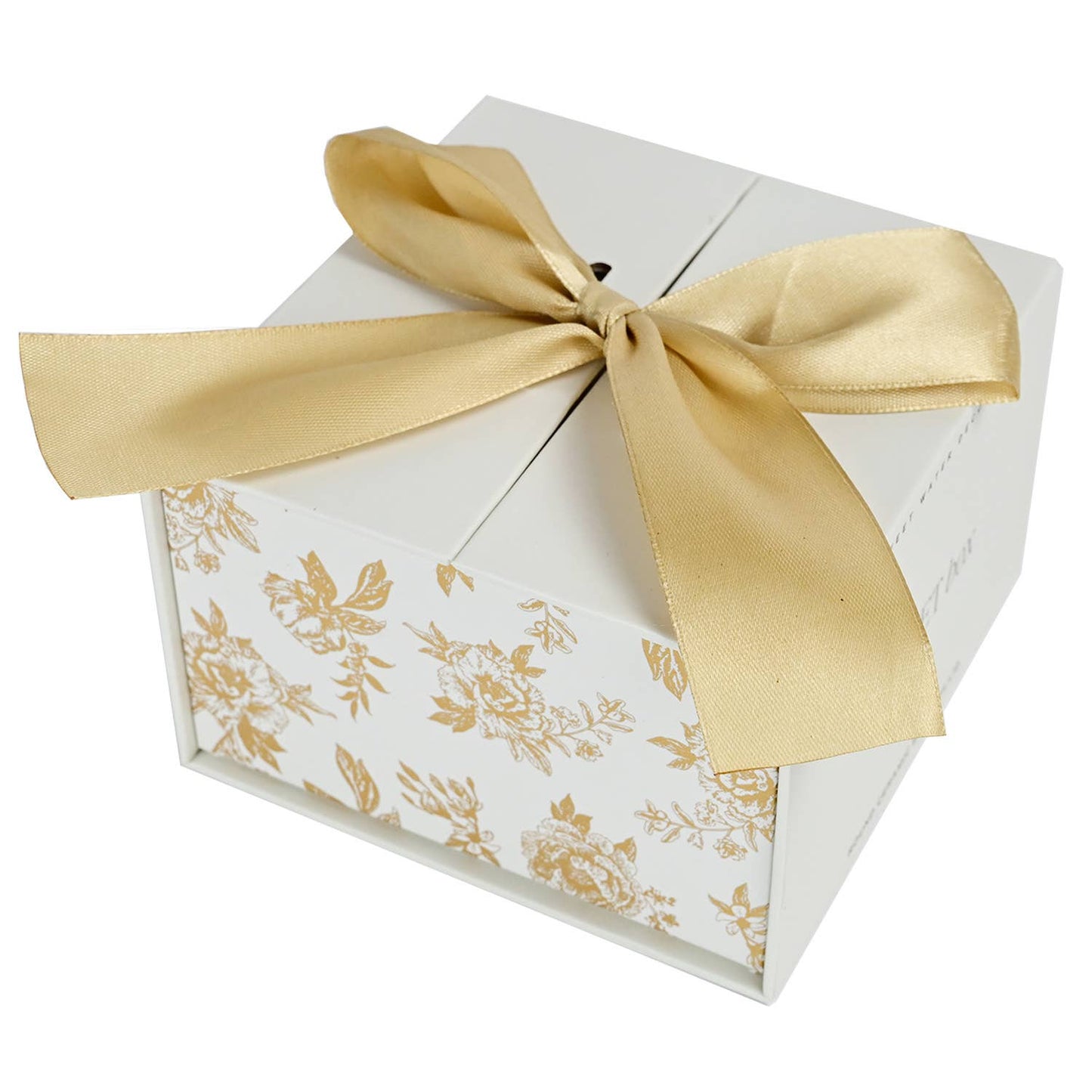 White gift box with gold floral patterns and a gold ribbon on a white background