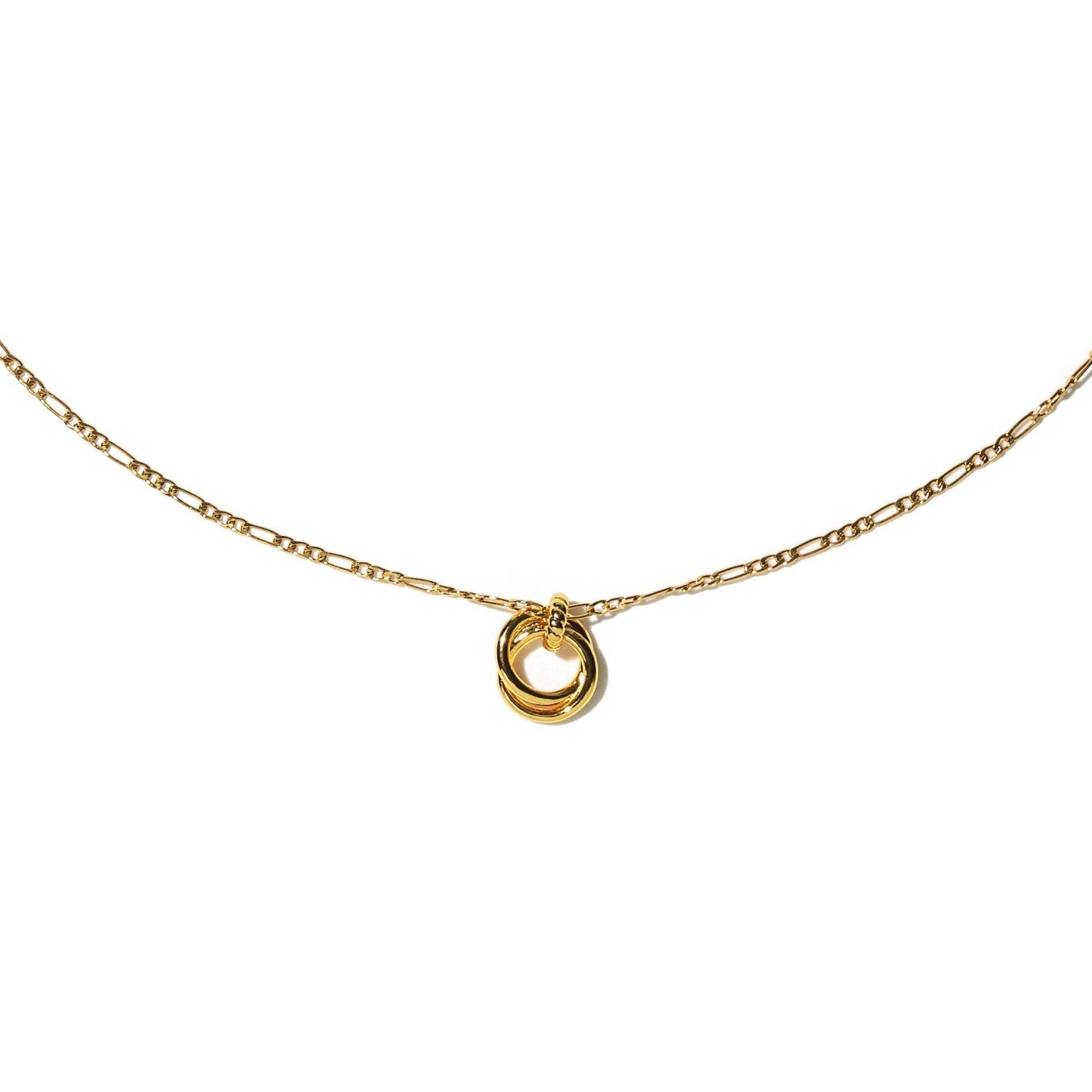 Gold necklace with a small round pendant on a white background