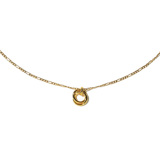 Gold necklace with a small round pendant on a white background