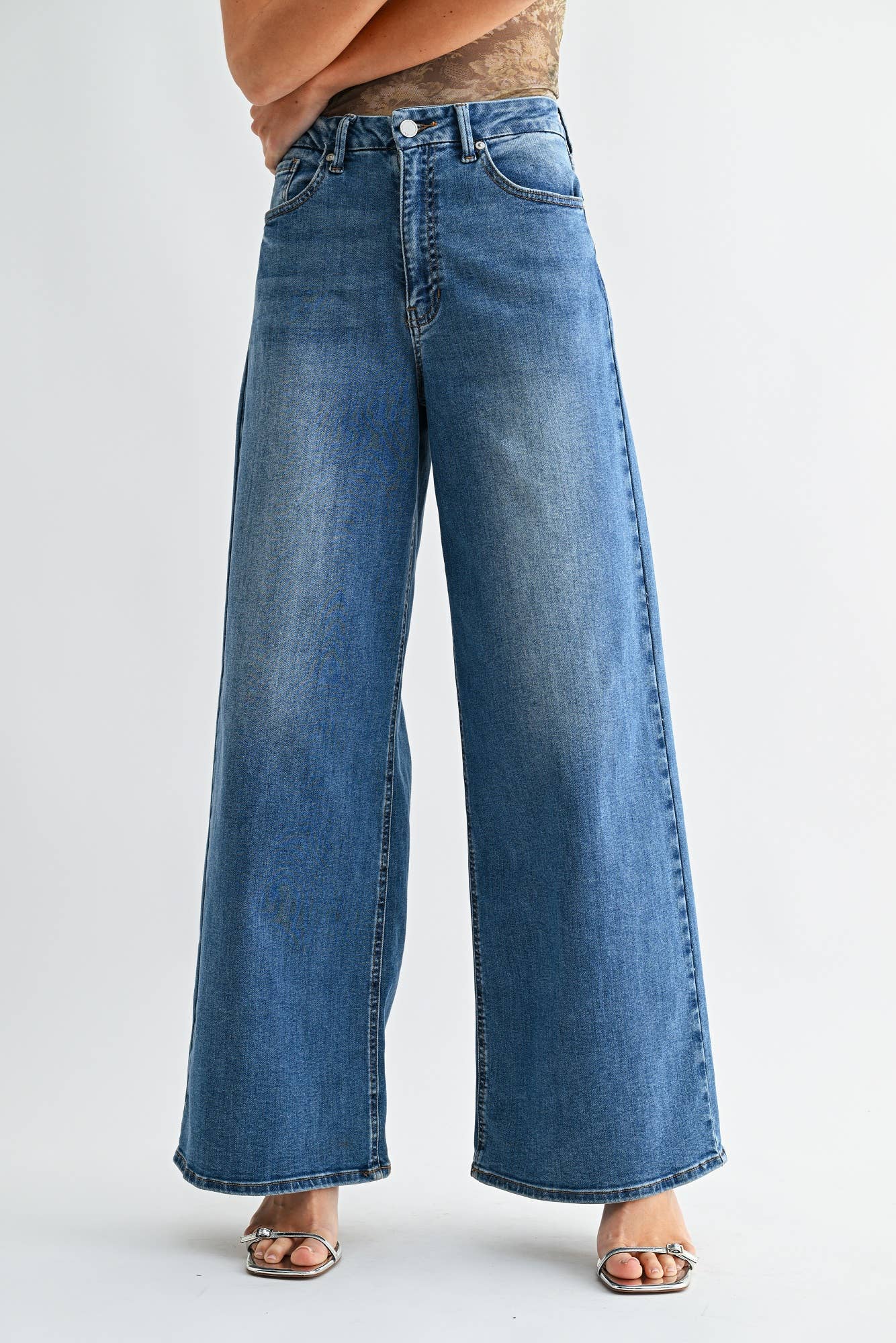 Wide-leg jeans on a plain background